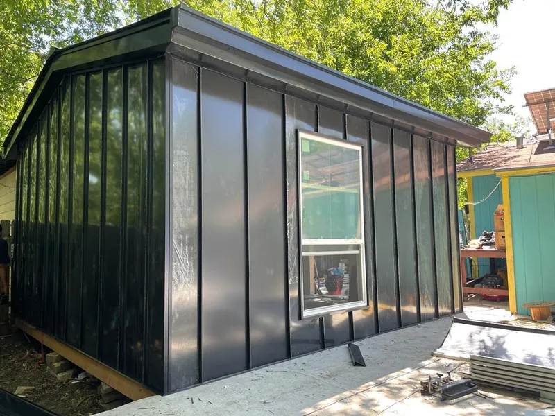 Black standing seam metal wall panels for Roof Inspection in Mayfield